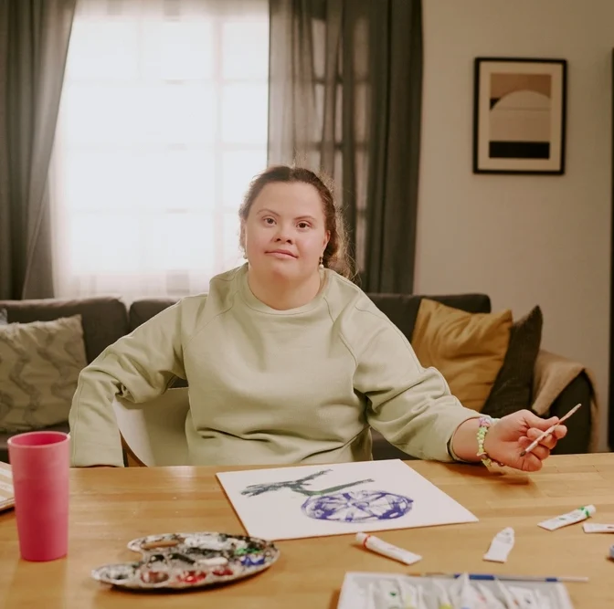 disabled girl with down syndrome drawing