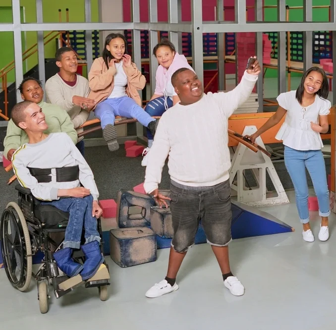 group of friends with different disability having fun and clicking pictures