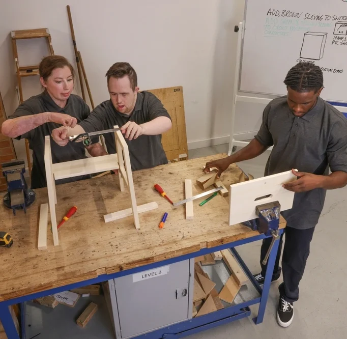 teaching a disabled boy carpentry work