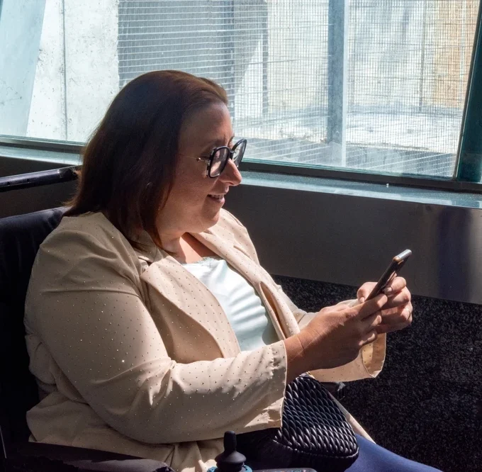 disabled women travelling in a special vehicle with a wheel chair