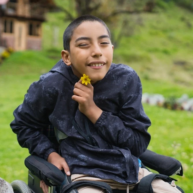 young boy with down syndrome on vacations in hills